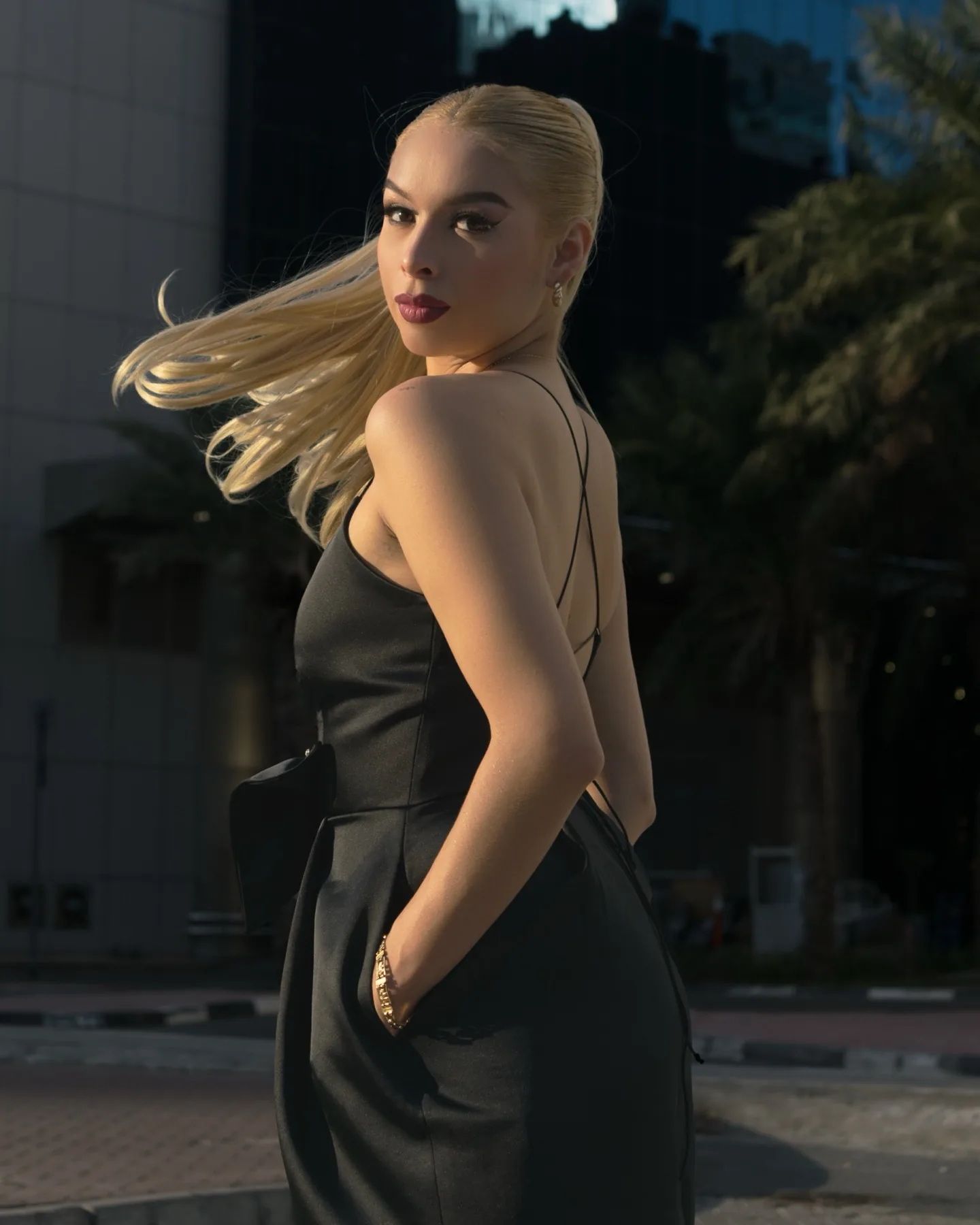 Elegant fitted outfit photographed against Dubai's Financial Centre architecture